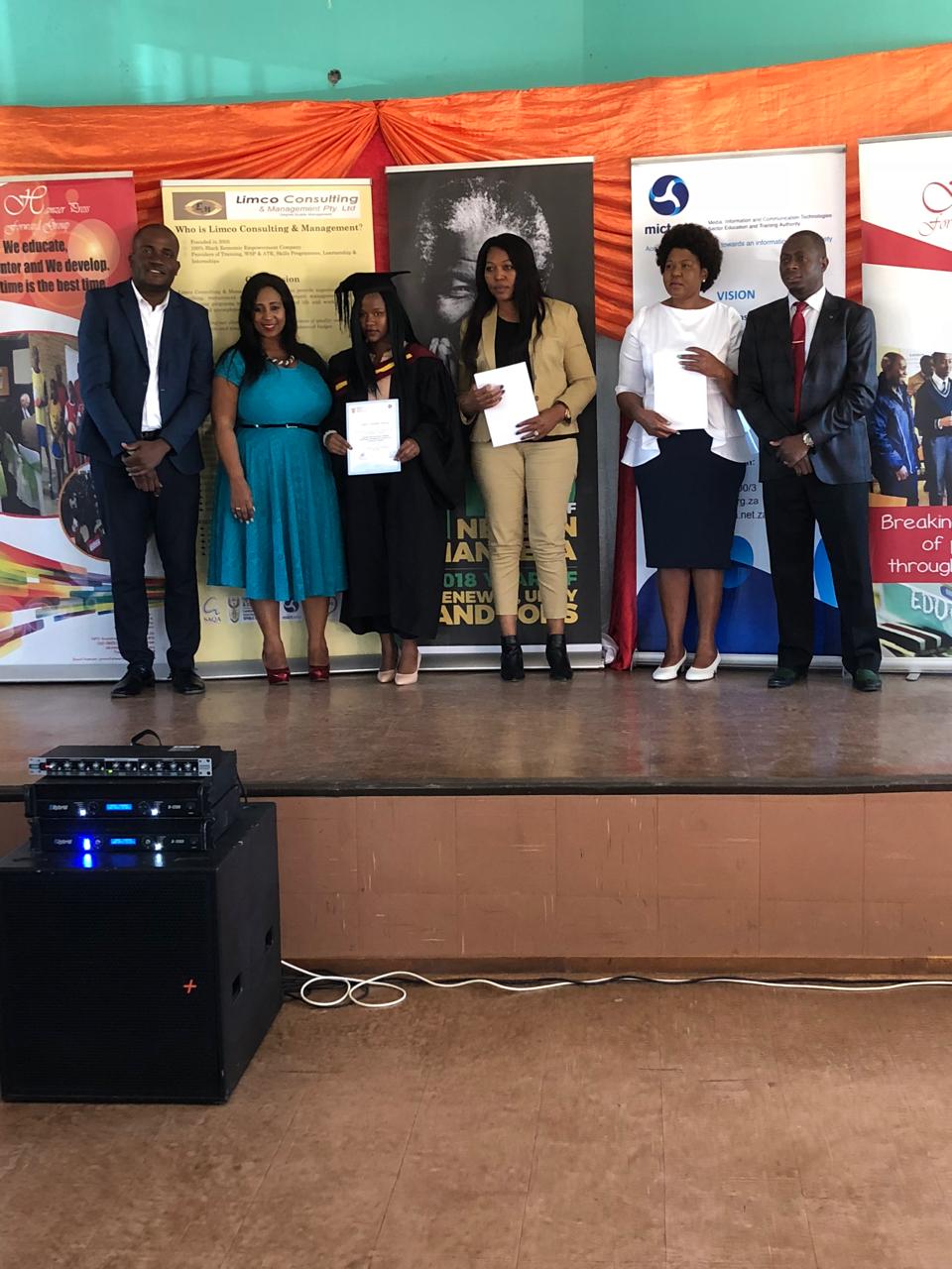 Graduation group holding certificates outdoors with Limco branding.